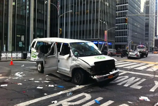 The totaled van and, in the background, Mercedes